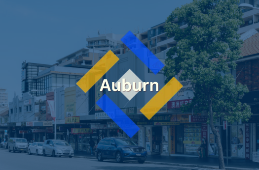 Auburn roadside shops overlapped by PURE Epoxy Floor Branding and company logo