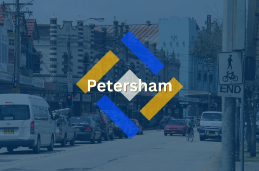 Petersham, NSW roadside with background buildings, overlapped by blue filter & PURE Epoxy Floor Services logo and branding